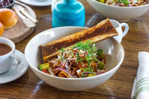 a bowl of salad and a sandwich on a table at Casa 1810 Hotel Boutique in San Miguel de Allende