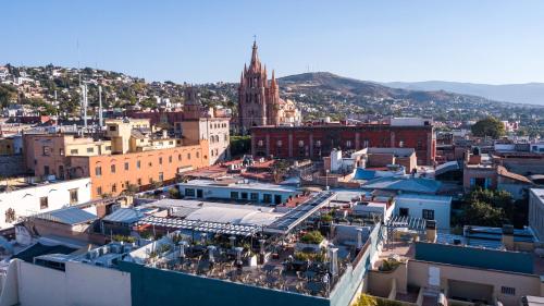 an aerial view of a city with a clock tower at Casa 1810 Hotel Boutique in San Miguel de Allende