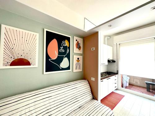 Ένα ή περισσότερα κρεβάτια σε δωμάτιο στο Sunset Suite - Appartamento al Mare - Marina di Carrara