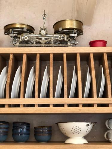 a shelf with a bunch of utensils on it at Löberbauer, Ferienwohnung in Tux