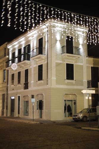 a white building with lights on top of it at Volsci Rooms in Sora