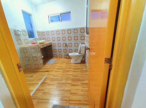 a bathroom with a toilet and a sink at Apartment in Holidays Beach Resort in Bolinao