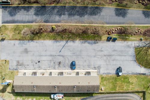 an overhead view of a building with cars in a parking lot at The Inn at Lewes in Rehoboth Beach