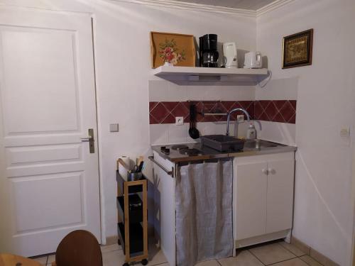 Kuchyň nebo kuchyňský kout v ubytování Appartement dans un chalet de montagne