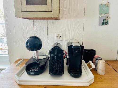 a kitchen counter with a blender on a cutting board at Appartement de standing à Vallorbe in Vallorbe