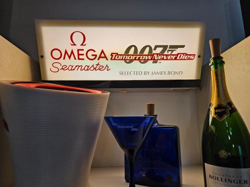 a bottle of wine next to someousandousandousandousandousandousandousandousandousand at Southsea Royale James Bond 3 bed Cool Penthouse, seafront parking in Portsmouth