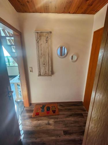 a room with a door and a rug on the floor at Strandhaus Scherko in Borkum