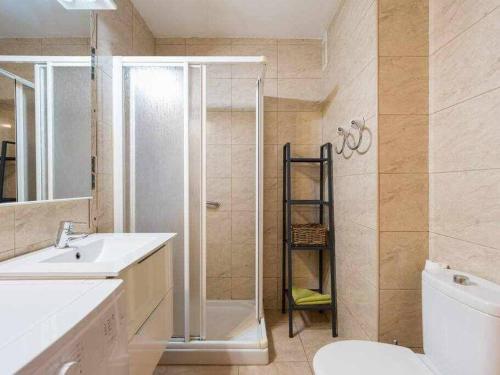 a bathroom with a shower and a toilet and a sink at Marlenghi Apartments 818 in San Bartolomé