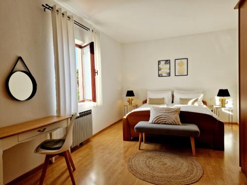 a bedroom with a bed and a chair and a mirror at Villa Aleksandar Porec in Poreč