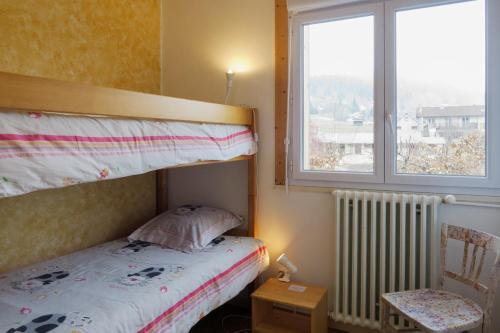 Postel nebo postele na pokoji v ubytování Gîte EDELWEISS - 4 personnes - "Les Gites du Chalet" à Autrans