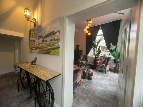 a hallway with a table and a living room at Boutique Hotel in Bad Salzuflen