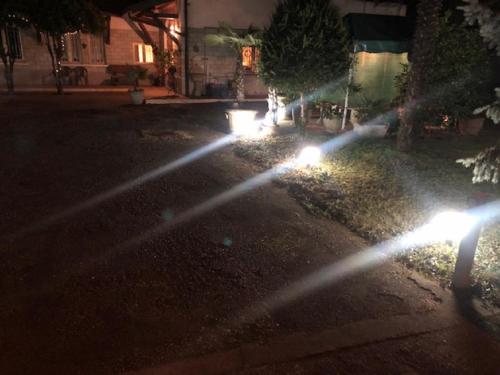 a group of lights on a street at night at Casa Stella Malpensa in Cassano Magnago