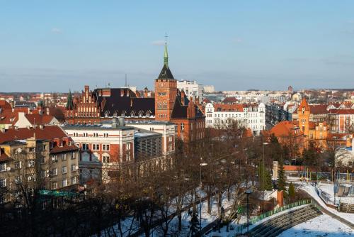 a view of a city with buildings and trees at Kairos Apartments - Amber - darmowy Parking, ścisłe centrum in Gliwice