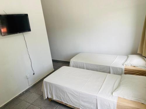 Säng eller sängar i ett rum på Granvalle Hotel Juazeiro