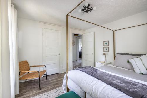 a bedroom with a bed with a large mirror at The Akron Retreat: Modern 3-Bedroom Oasis in Akron