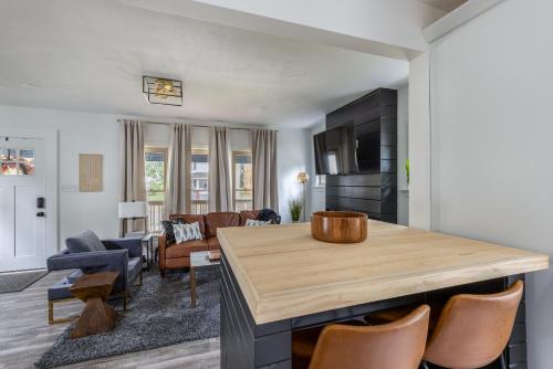 a kitchen and living room with a table and chairs at The Akron Retreat: Modern 3-Bedroom Oasis in Akron