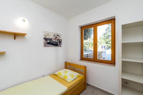 Postel nebo postele na pokoji v ubytování Apartments Jonke