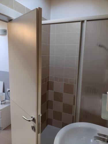 a bathroom with a shower and a sink at Casa Terrazzo Panoramico in Cannobio