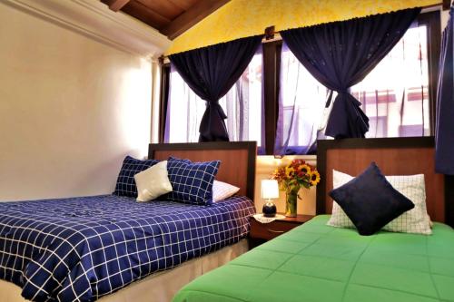 Hotel Posada el Arcangel tesisinde bir odada yatak veya yataklar