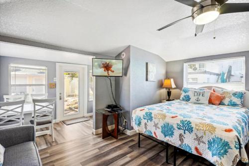 a bedroom with a bed and a dining room at C4-Octopus in St Pete Beach