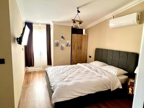 Tempat tidur dalam kamar di Mustafa Tokalaç Castle house