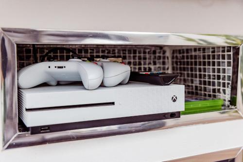 a plastic container with some objects in it on a shelf at Willow Chalet near Cartmel & Lake Windermere in Flookburgh