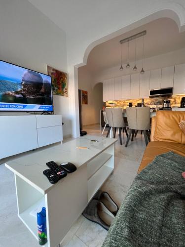 a living room with a couch and a tv at JOY in San Juan