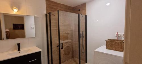 a bathroom with a shower and a toilet and a sink at Live at TLV in Tel Aviv