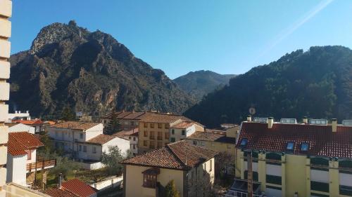 a view of a town with mountains in the background at Peñas de Arnedillo in Arnedillo