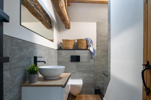 a bathroom with a sink and a toilet at Brow Top Cottage, Penrith, Lake District in Skelton