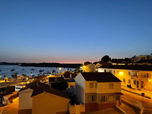a view of a city at night with a harbor at Alvor River & Sea View in Alvor