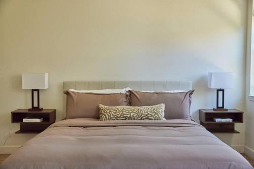 a bedroom with a large bed with two lamps at NEW Upscale House, Tahoe 30-min w/ Cal King in Steamboat