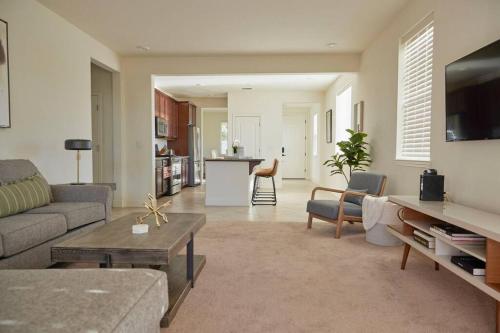a living room with a couch and a table at NEW Upscale House, Tahoe 30-min w/ Cal King in Steamboat