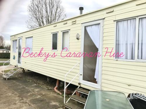 a mobile home with the words babies can am live at Becky's Caravan at Marton Mere in Blackpool