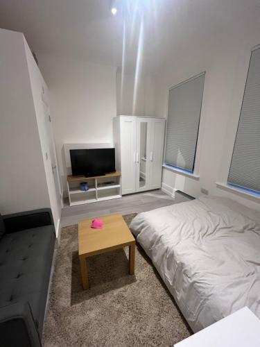 מיטה או מיטות בחדר ב-studio flat in Camden Town