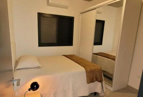 Ένα ή περισσότερα κρεβάτια σε δωμάτιο στο Casa em Barequeçaba recém construída Alto Padrão