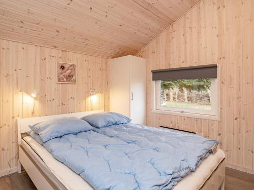 Giường trong phòng chung tại Holiday home Tranekær XXXIII