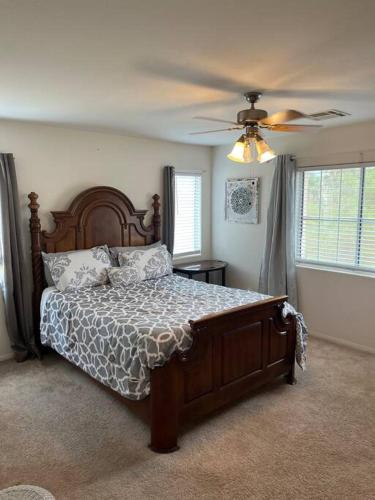 a bedroom with a bed and a ceiling fan at Vic's 3 bedroom 4beds & POOL centrally located! in Las Vegas