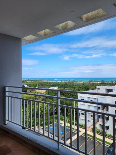 a balcony with a view of the ocean at Hillside Village Retreat in Rio Grande