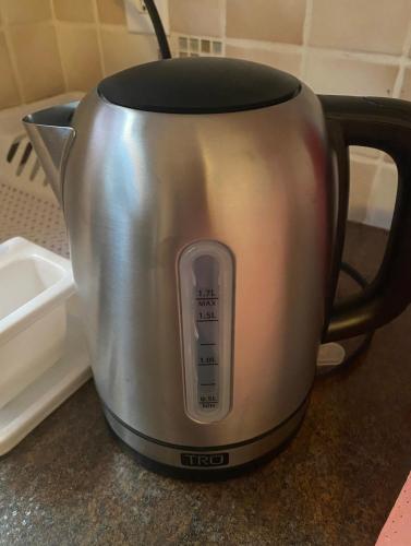 a silver coffee pot sitting on a counter at Heaven Is A Place On Earth in Montréal