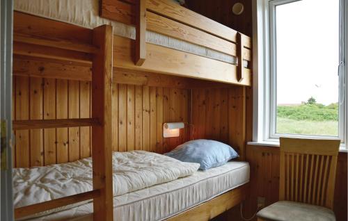 a bedroom with a bunk bed and a window at Awesome Home In Ringkbing Dk With Wifi in Søndervig