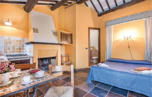 a bedroom with a bed and a fireplace at Il Casale Della Sabina in Magliano Sabina