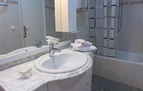 a bathroom with a sink and a bath tub at 2 Bedroom Lovely Apartment In Santa Pola in Santa Pola