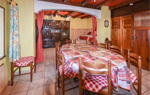 a dining room with a table and chairs at 3 Bedroom Gorgeous Home In Intres in Saint-Agrève