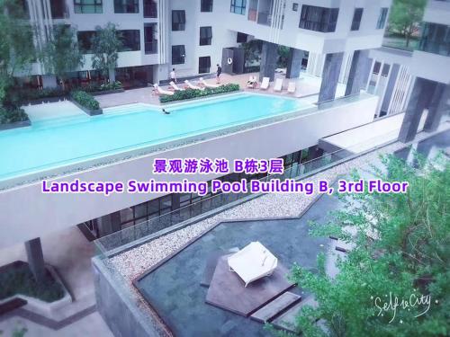 an image of a swimming pool in a building at 芭提雅双人精品公寓无边游泳池THEBASE中央基地 in Pattaya