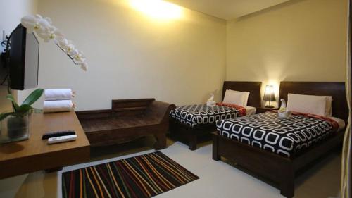 Cama o camas de una habitación en Rai House Sanur