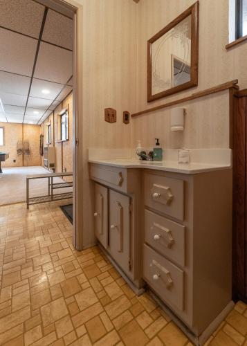 a bathroom with a sink and a mirror at Hygge Haus Sequoia - Large Private Cabin w Views in Ponderosa