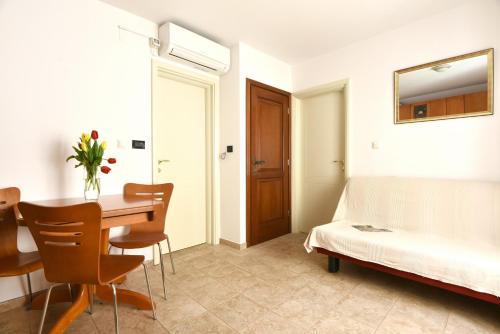 Postel nebo postele na pokoji v ubytování Apartments Kokolo