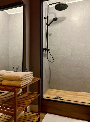 a shower with a glass door in a bathroom at Azalia Karpacz in Karpacz