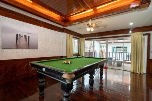 a pool table in a room with a ceiling at Angel Pool Villa Phuket - SHA Extra Plus in Phuket Town
